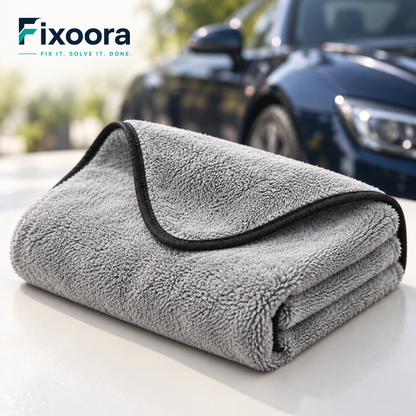 Fixoora Plush Microfiber Car Drying Towel folded beside a car